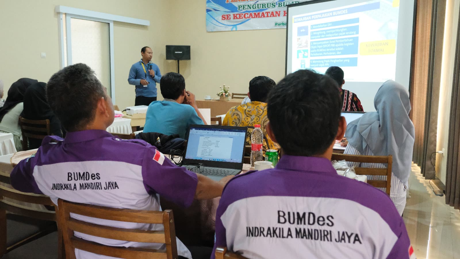 Tax officer explaining BUMDes tax obligations to village officials
