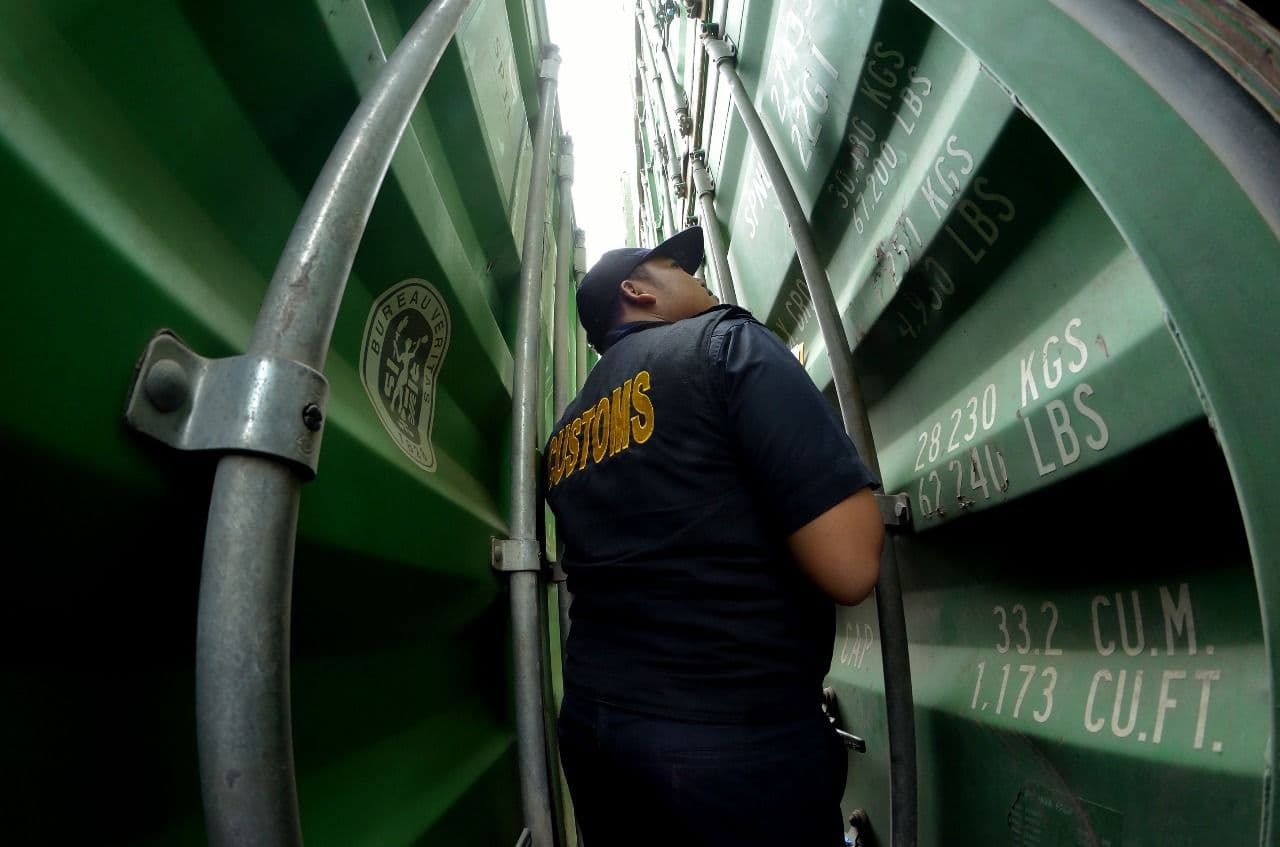 Customs officers in Tanjungpinang inspecting cargo
